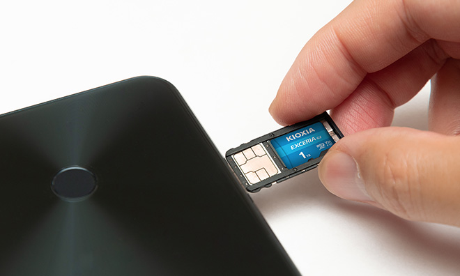 Inserting EXCERIA G2 microSD Card into device